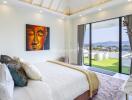 Modern bedroom with wall art and large windows