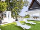 Beautiful outdoor area with lounge chairs and a covered dining space