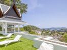 Outdoor terrace with lounge chairs and scenic view