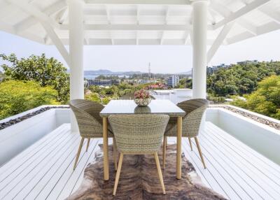 Spacious outdoor patio with dining table and chairs