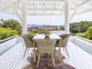 Spacious outdoor patio with dining table and chairs