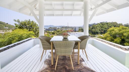 Spacious outdoor patio with dining table and chairs