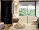 Modern bathroom with view of nature, featuring a toilet, sink, and a large window.