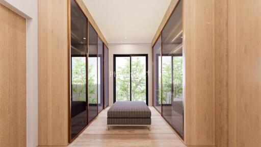 Spacious and modern walking closet with large windows