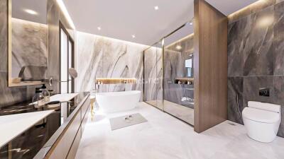 Modern bathroom with marble walls, bathtub, glass shower, and toilet
