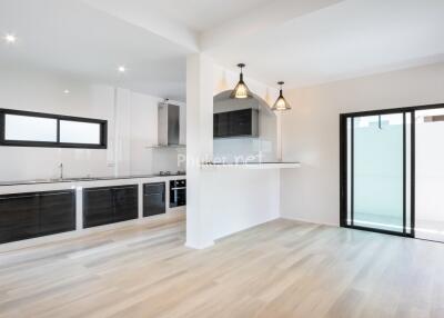 modern kitchen with appliances and dining area with sliding doors