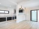 modern kitchen with appliances and dining area with sliding doors