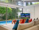 Spacious living room with pool view and modern decor