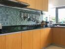 Modern kitchen with wooden cabinets and tiled backsplash