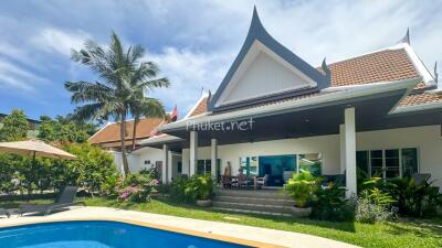 Exterior view of a luxury villa with swimming pool in a tropical setting