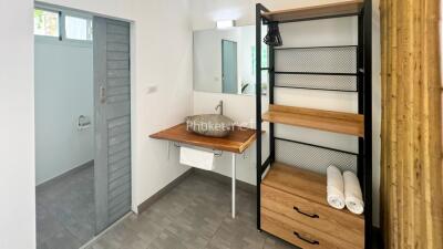 Modern bathroom with vanity sink and open shelves