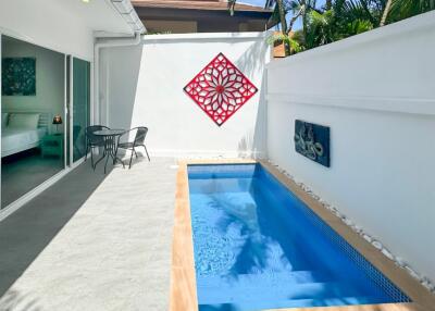 Outdoor area with small pool and seating