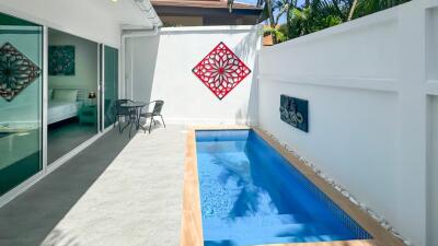 Outdoor area with small pool and seating