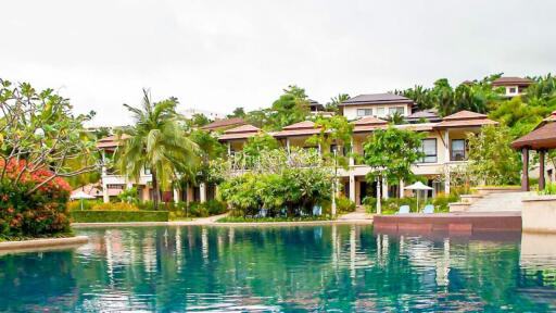 Exterior view of luxury property with a swimming pool