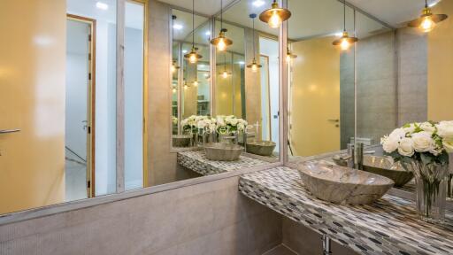 Modern bathroom with stylish sink and lighting