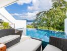 Outdoor seating area with pool and scenic view