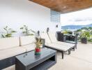 Spacious balcony with outdoor seating and scenic view