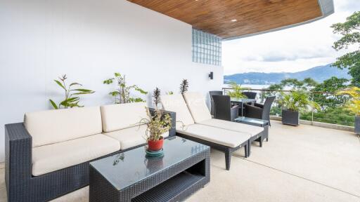Spacious balcony with outdoor seating and scenic view