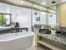 Modern bathroom with double vanity and bedroom in the background