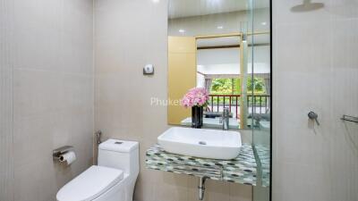 Modern bathroom with glass shower partition