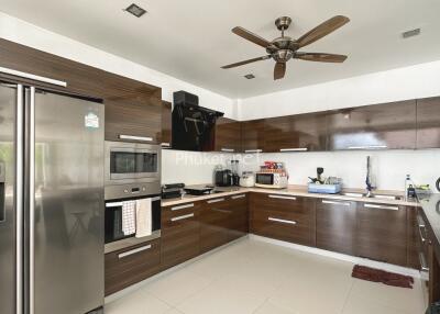 Modern kitchen with dark wood cabinets