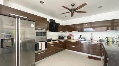 Modern kitchen with dark wood cabinets