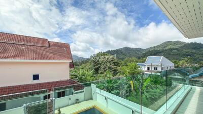 Scenic view from balcony with mountain and pool