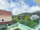 Scenic view from balcony with mountain and pool