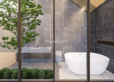 Modern bathroom with large bathtub and indoor plants