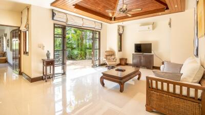 Spacious living room with modern furniture and large windows