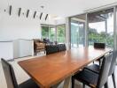 Modern dining room with large windows and wooden table