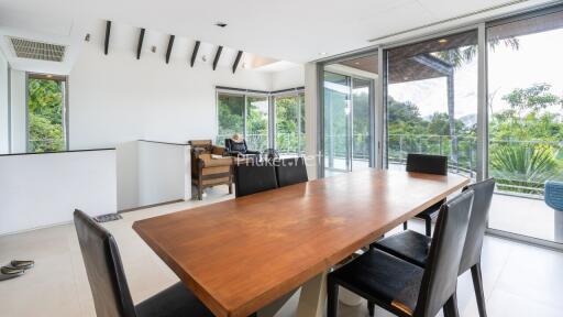 Modern dining room with large windows and wooden table