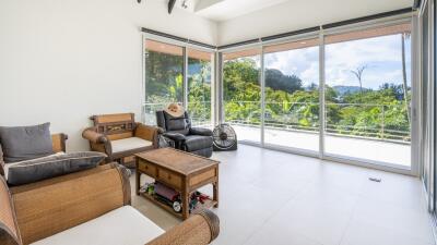 Spacious living room with large windows and a scenic view