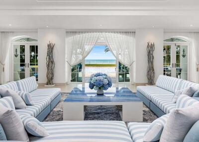 Spacious and elegant living room with a beach view