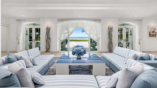 Spacious and elegant living room with a beach view