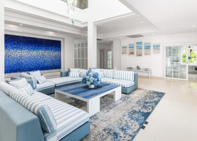 Modern and spacious living room with blue-themed decor