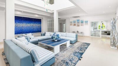 Modern and spacious living room with blue-themed decor