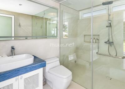 Modern bathroom with glass shower and vanity