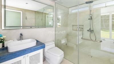 Modern bathroom with glass shower and vanity