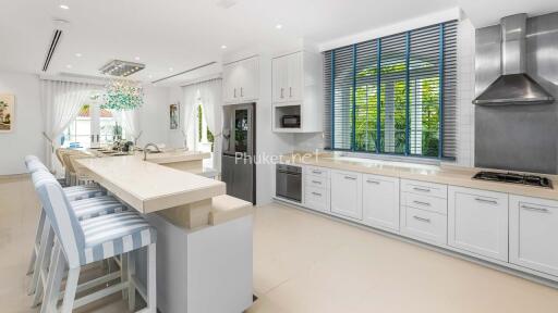 Modern kitchen with high-end appliances and a breakfast bar