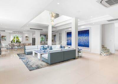 spacious and modern living room with blue accents