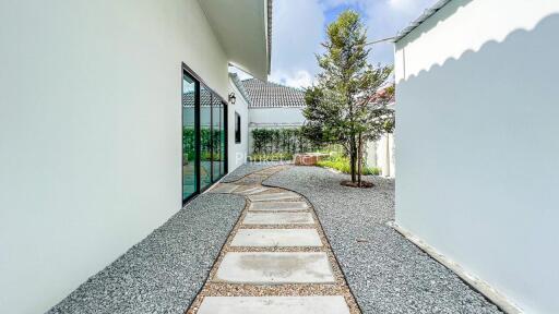 Well-maintained backyard with walking path