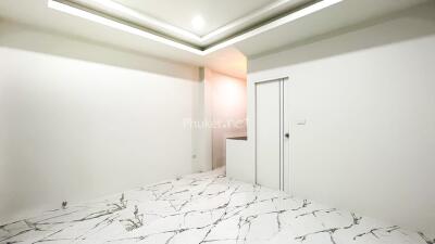 Spacious room with marble floor and modern lighting