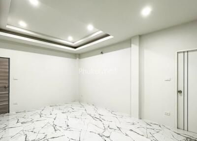 Empty room with modern lighting and marble flooring