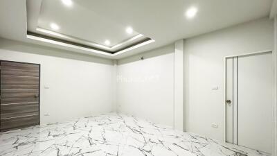 Empty room with modern lighting and marble flooring