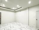 Empty room with modern lighting and marble flooring