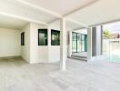 Covered patio area with tiled flooring and view of swimming pool