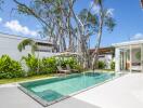 Outdoor area featuring a swimming pool and lush garden