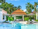 Beautiful outdoor swimming pool area with lounge chairs and greenery