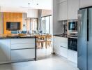 Modern kitchen with dining area in the background